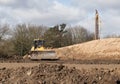 Industrial bulldozer moving earth on a construction site