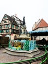 Petit Venice, fountain, square and colorful traditional french houses Colmar, France.