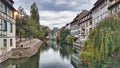 View of the old buildings on the riverbanks reflecting on river Ill, Strasbourg Royalty Free Stock Photo