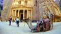 Tourists view the Al-Khazneh ancient city of Petra in Jordan Royalty Free Stock Photo
