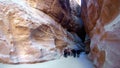 Tourists view the canyon ancient city of Petra in Jordan