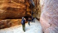 Tourists view the canyon ancient city of Petra in Jordan