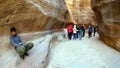 Tourists view the canyon ancient city of Petra in Jordan