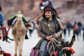 Arab bedouin guide riding in the ancient city of Petra, Jordan