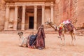 PETRA, JORDAN - MARCH 23, 2017: Camels in front of the Al Khazneh temple (The Treasury) in the ancient city Petra, Jord Royalty Free Stock Photo