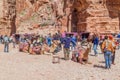 PETRA, JORDAN - MARCH 24, 2017: Tourists, camels and horse carriages in the ancient city Petra, Jord