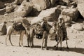 Unidentified man looks for tourists for camel ride