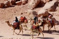 Unidentified man looks for tourists for camel ride