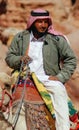 Men looks for tourists for camel ride.