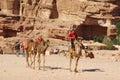 Unidentified men looks for tourists for camel ride Royalty Free Stock Photo