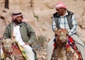 Men looks for tourists for camel ride. Royalty Free Stock Photo