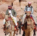 Men looks for tourists for camel ride. Royalty Free Stock Photo