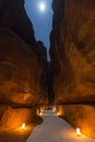 Petra by night with full moon, narrow gorge of the Siq, Jordan