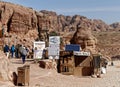 Petra, Wadi Musa, Jordan, March 9, 2018: A stall with many signs of refreshments, books and tourist souvenirs