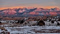 Petrified sand dunes and La Sal Mountains at sunset. Royalty Free Stock Photo