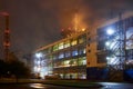 Petrochemical plant in night. Urea Granulation Tower fertilizer granulator prilling high-tower complex. Long exposure Royalty Free Stock Photo