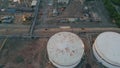 Petrochemical plant tanks top view. Drone flying over industrial infrastructure Royalty Free Stock Photo