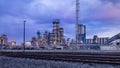 Petrochemical production plant against a cloudy blue sky at twilight, Port of Antwerp, belgium