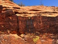 Petroglyphs on the rock canyon wall in Snow Canyon State Park in Utah Royalty Free Stock Photo