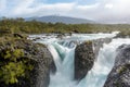 Petrohue Falls and Osorno Volcano with its snowy peak near Puerto Varas, Chile Royalty Free Stock Photo