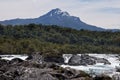 Petrohue Falls and Pontiagudo Volcano in Chile Royalty Free Stock Photo