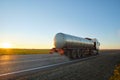 Petrol cargo truck driving on highway hauling oil products. Delivery transportation and logistics concept Royalty Free Stock Photo