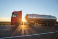 Petrol cargo truck driving on highway hauling oil products. Delivery transportation and logistics concept Royalty Free Stock Photo