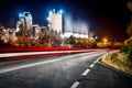 Petrol oil refining industry, with cooling tank in operation at night near the street.