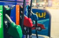 Petrol pump filling fuel nozzle in gas station. Fuel dispenser. Refuel fill up with petrol gasoline. Gas pump handle. Red petrol Royalty Free Stock Photo