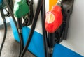 Petrol pump filling fuel nozzle in gas station. Fuel dispenser. Refuel fill up with petrol gasoline. Gas pump handle. Red petrol Royalty Free Stock Photo