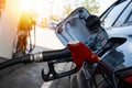 Petrol pump filling fuel nozzle in fuel tank of car at gas station. Petrol industry and service