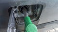Petrol pump filling. Gas nozzle pumping gas into a car. Car refueling on a petrol station