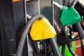 Petrol pump filling yello Royalty Free Stock Photo