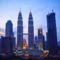 Petronas Twin Towers fondly known as KLCC and the surrounding buildings at evening Royalty Free Stock Photo