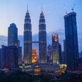 Petronas Twin Towers fondly known as KLCC and the surrounding buildings at evening Royalty Free Stock Photo