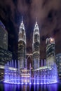 Petronas Twin Towers in Kuala Lumpur Downtown with fountain shows, Malaysia. Financial district and business centers in smart Royalty Free Stock Photo