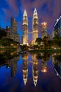 Petronas Twin Towers in Kuala Lumpur Downtown with reflection, Malaysia. Financial district and business centers in smart urban Royalty Free Stock Photo