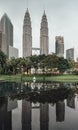 Petronas twin towers that reflected on the pool in Kuala Lumpur, Malaysia Royalty Free Stock Photo