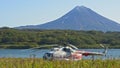 Petropavlovsk-Kamchatskiy, Russia, September 20, 2020,Modern aircraft and nature helicopter at lake and mountain