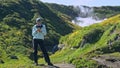 Petropavlovsk-Kamchatskiy, Russia, September 20, 2020 woman makes selfie with iphone smartphone on rocky to geysers