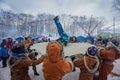 Petropavlovsk-Kamchatsky, Russia - February 22, 2021: Koryaks in traditional clothes rock a child on a canvas