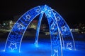 Petrozavodsk Karelia Russia 01.12.24 New Year's glowing decorative arch with decorations and flashing lights. Blue