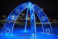 Petrozavodsk Karelia Russia 01.12.24 New Year's glowing decorative arch with decorations and flashing lights. Blue