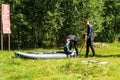 Family in wetsuits near an inflatable boat Royalty Free Stock Photo