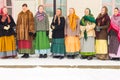 A female team in a traditional outfit performs Russian folk songs and folklore motifs.