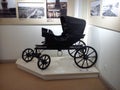 Petrozavodsk / Russia - June 30, 2019: old-fashioned wagon for one person. Carriage made of metal and wood, painted black. Trendy