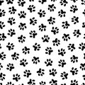 Pets footprint black background. Paw steps dog or cat, wild animal foot silhouettes. Simple abstract seamless pattern