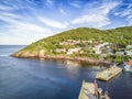 Petty Harbour with two piers during summer sunset, Newfoundland, Canada Royalty Free Stock Photo