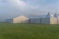 Marquees in the morning mist.