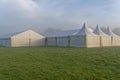 Marquees in the morning mist.